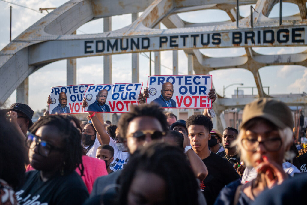 People march across the Edmund Pettus Bridge