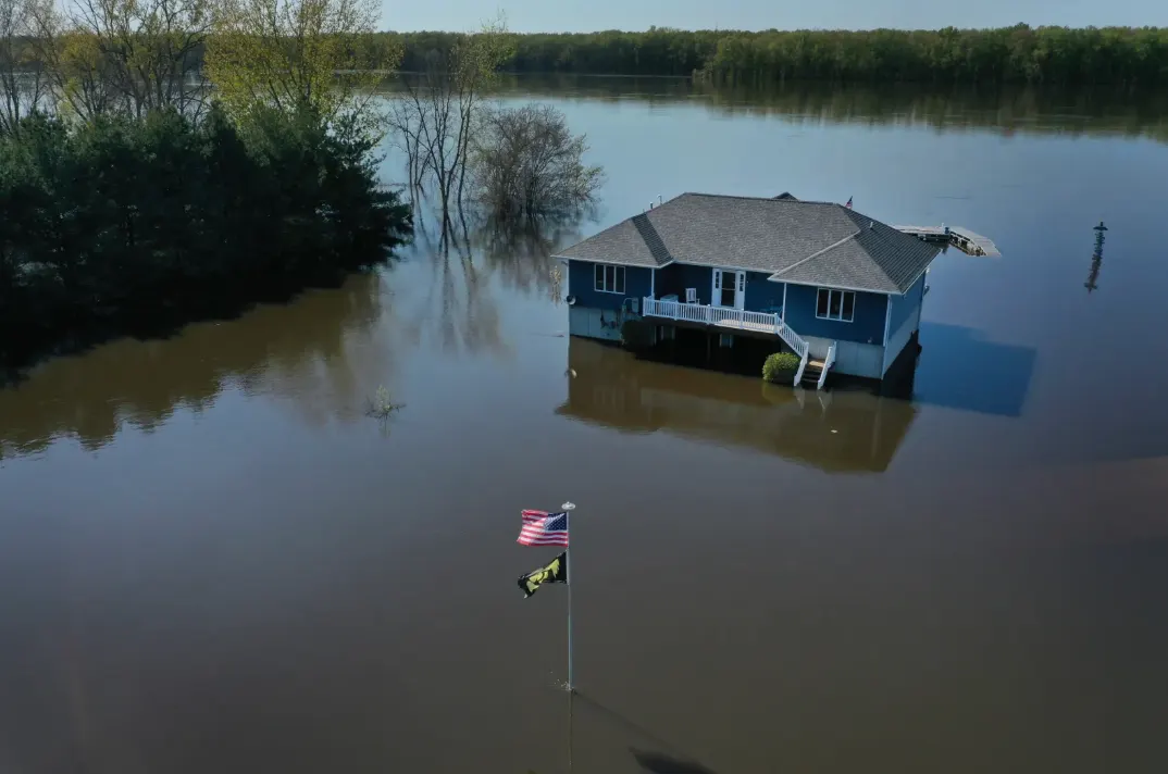 Flooded house with American flag